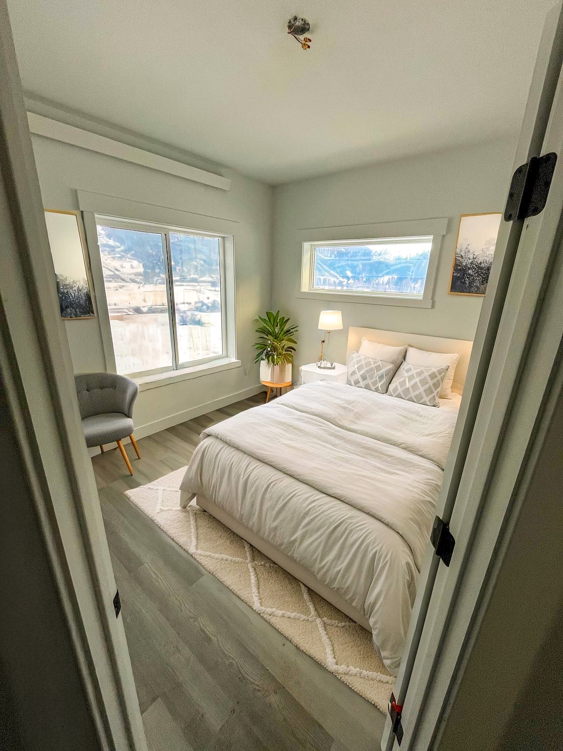 rendering of a bedroom with a queen bed.