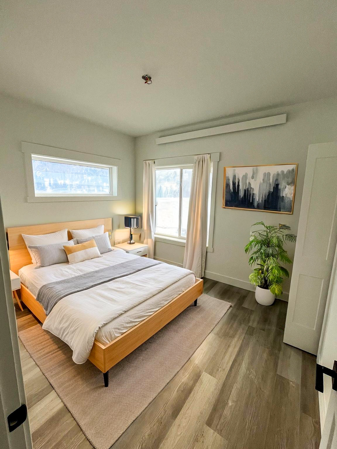 Rendering of a modern bedroom with a queen bed