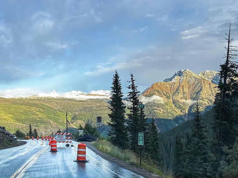 Image of highway 550 on Coal Bank Pass with road cones. 